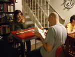Feb 29: Setsuko studies her Lost Cities hand while Doug checks the rules