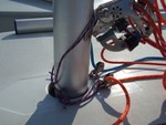 22 - Wrap the mast tiedown around the mast and tie a bowline